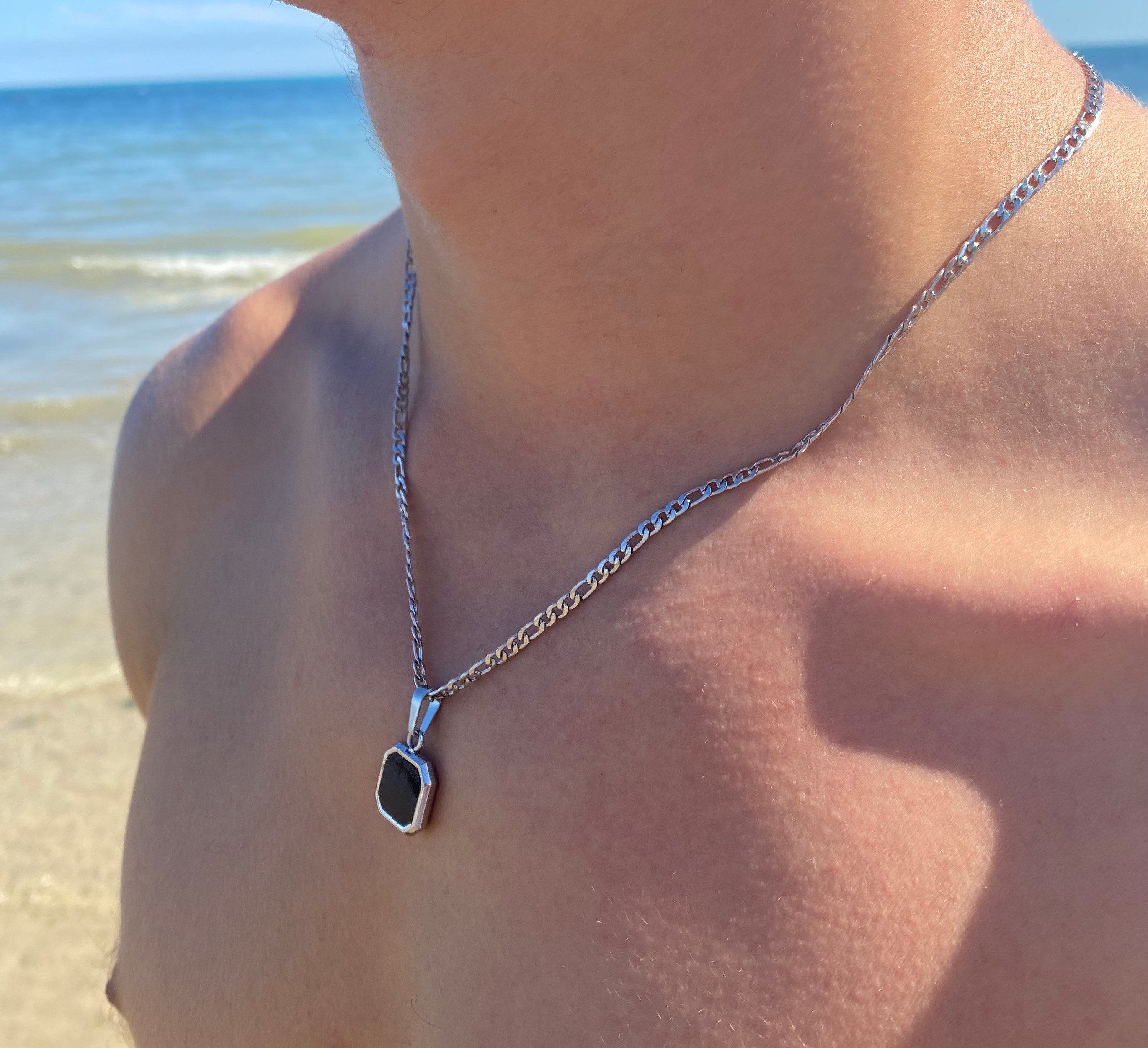 Movado |Men's black onyx pendant on chain